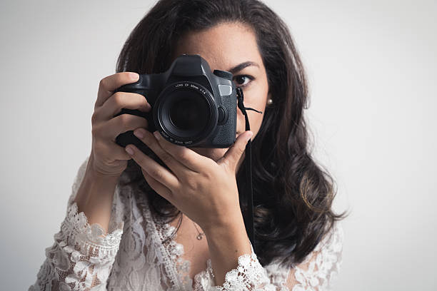 istock Photographer woman with camera 490219560