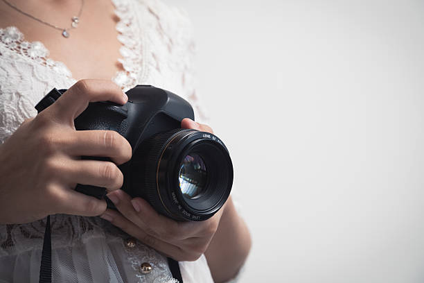 istock Photographer woman with camera 490219618