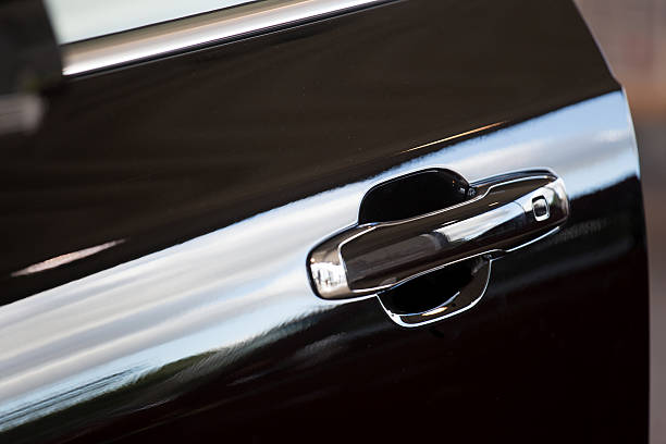 istock elegant open black car door - slanted 490219998