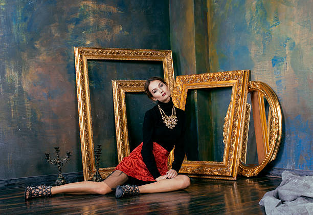 istock beauty rich brunette woman in luxury interior near empty frames 490220670