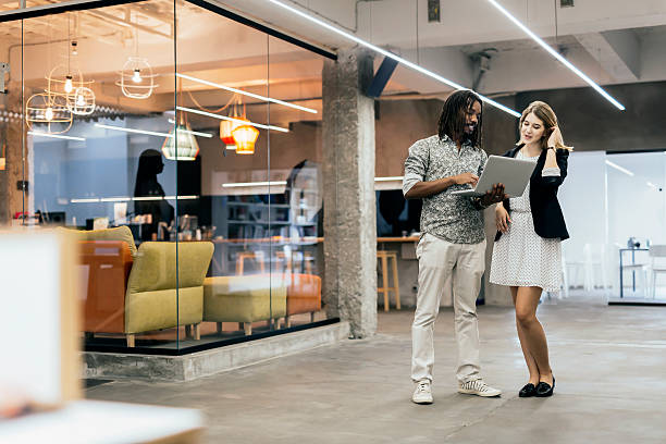 istock Coworkers talking in a modern office 490222710