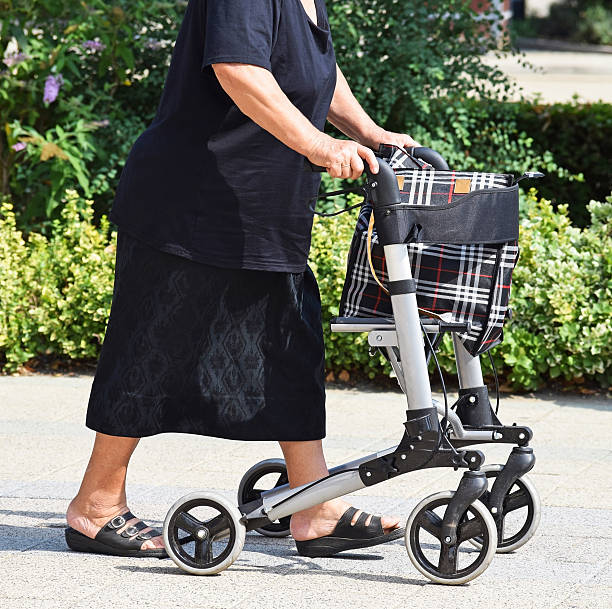 istock Old woman with a walker 490223454