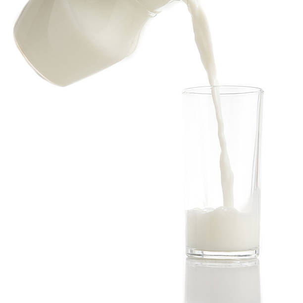 istock Pouring frsh milk into glass isolated 490224472