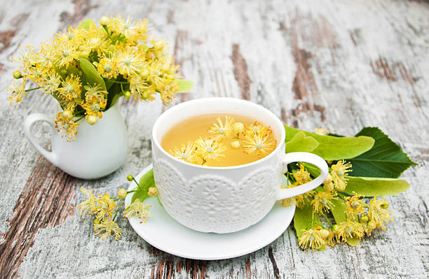 istock cup of herbal tea with linden flowers 490225458