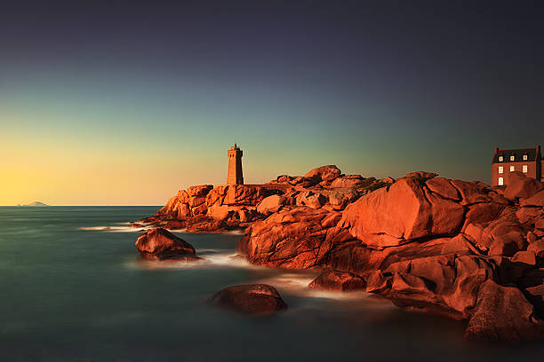 istock Ploumanach lighthouse sunset in pink granite coast, Brittany, Fr 490237562