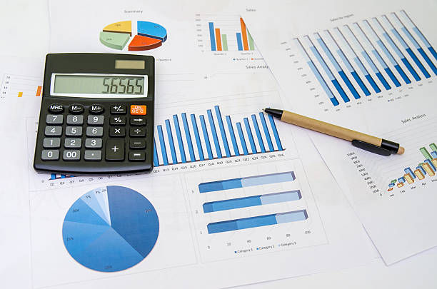 istock Financial accounting graphs analysis with pen and calculator 490238788