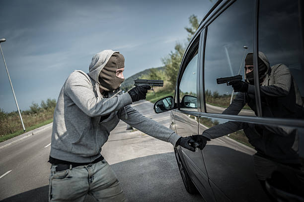 Robbery One person are taking aim at the in of car gunman photos stock pictures, royalty-free photos & images