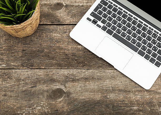 istock Grunge hipster wooden desktop with computer, digital tablet 490243916