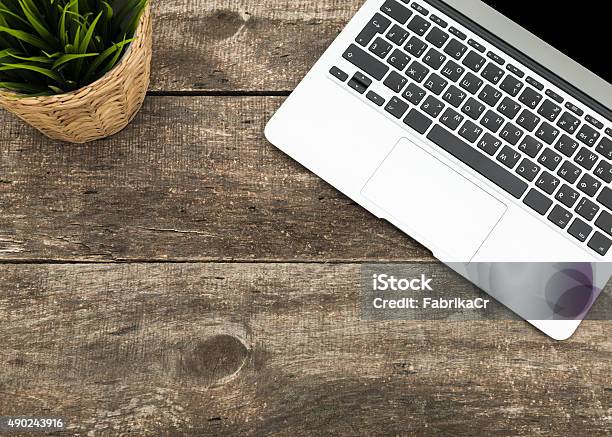 Grunge Hipster Wooden Desktop With Computer Digital Tablet Stock Photo - Download Image Now