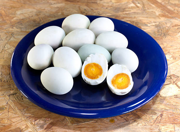 istock Salted egg in the blue dish on wooden table, 490243936
