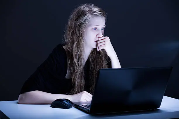 Photo of Girl suffering from electronic aggression