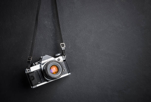 Vintage SLR camera hanging on the wall