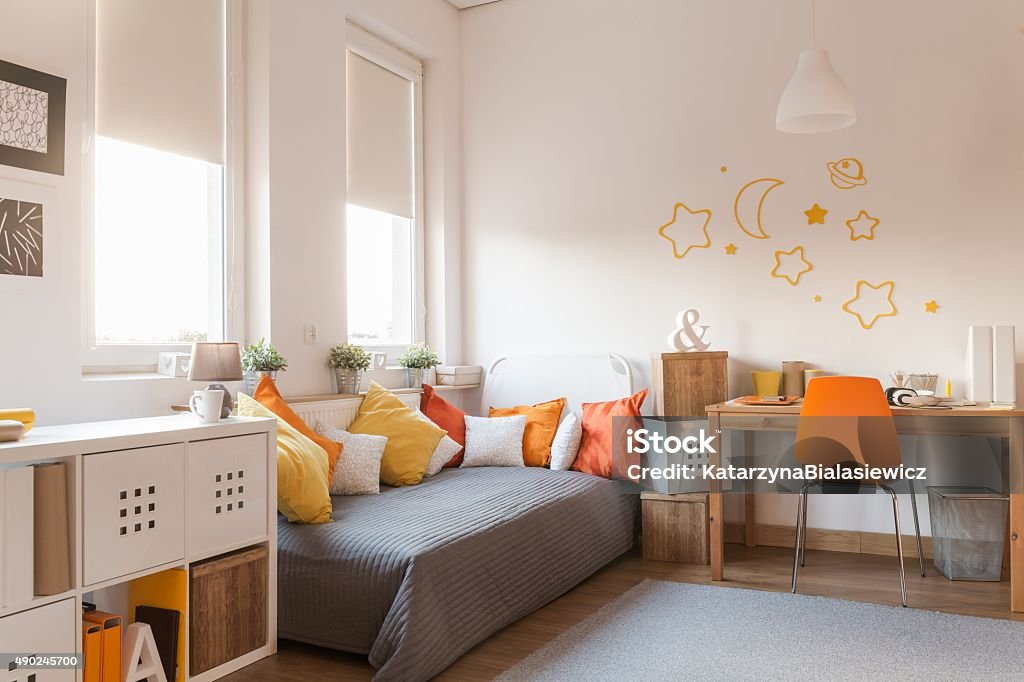 Yellow and orange accessories Yellow and orange accessories in modern teen room Child Stock Photo Yellow and orange accessories Yellow and orange accessories in modern teen room Child Stock Photo