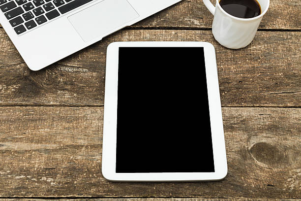 istock office working desk top view with laptop 490246370