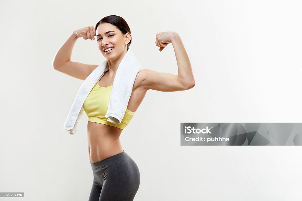 Fitness Woman Portrait Isolated on White Background. Happy femal Fitness Woman Portrait Isolated on White Background. Happy female Fitness model looking at camera. 2015 Stock Photo