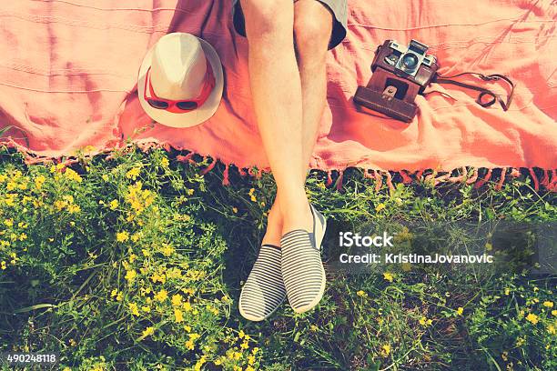 Relaxing In A Meadow In The Summer Sun Stock Photo - Download Image Now - Shoe, Springtime, Lying Down