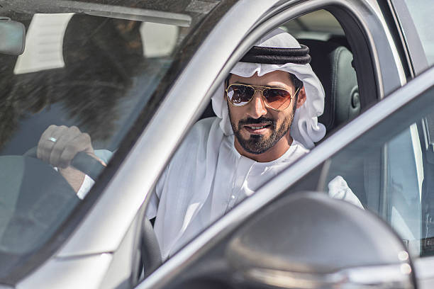 istock Emirati man getting on his car 490250674