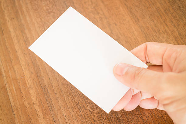istock Hand holding a business card 490251814