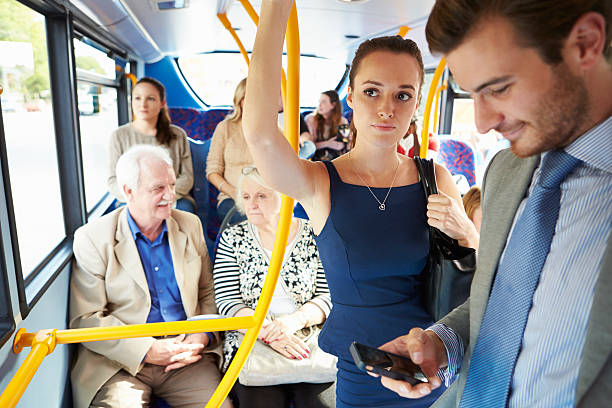 istock Passengers Standing On Busy Commuter Bus 490252560