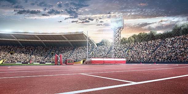 stadium with running tracks Sunny sport stadium with crowds of people at the background. On behind the stadium are green trees. The image was made in 3d. image created 21st century blue architecture wide angle lens stock pictures, royalty-free photos & images