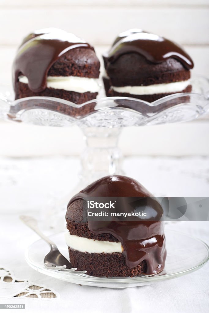 Chocolate cakes Chocolate cakes with cream and ganache Baked Stock Photo