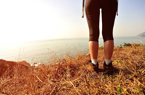 istock hiking legs seaside mountain peak 490263133