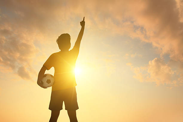 istock Man and soccer silhouette 490265105