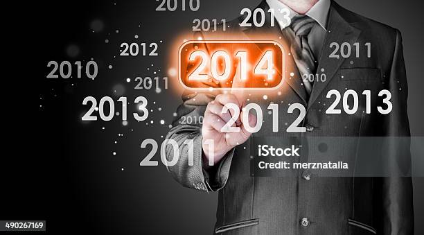 Businessman Touching New Year 2014 Stock Photo - Download Image Now - 2014, Abstract, Adult