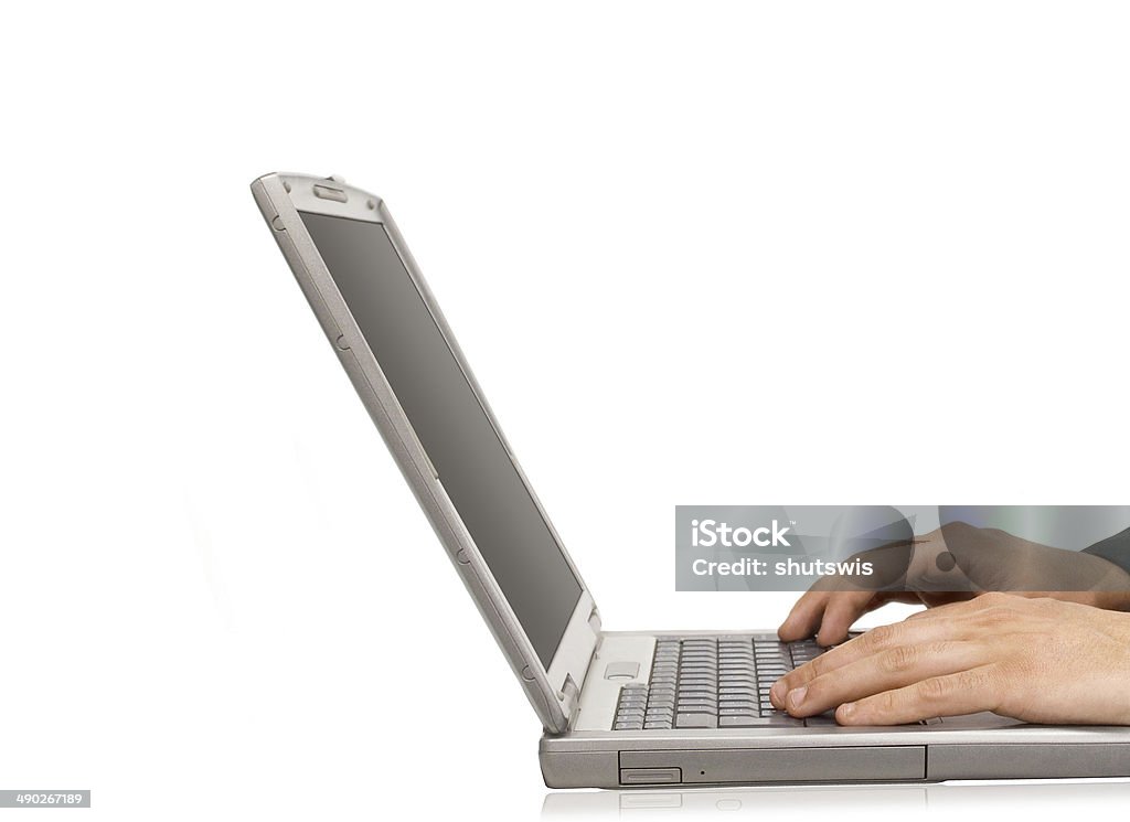 Businessman typing on a notebook Adult Stock Photo