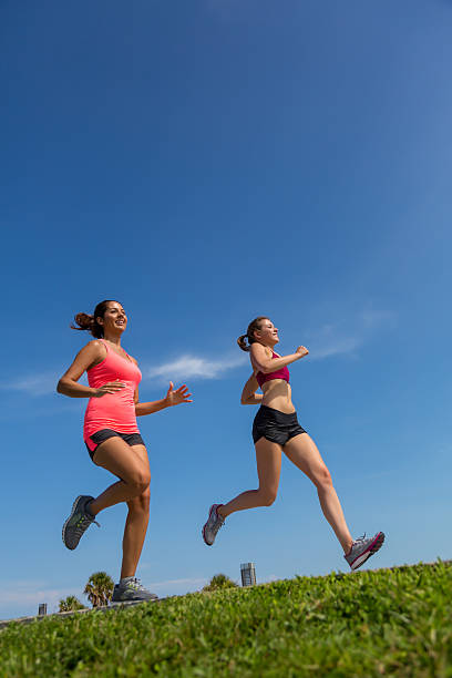 running people in orange shirts, motion blur