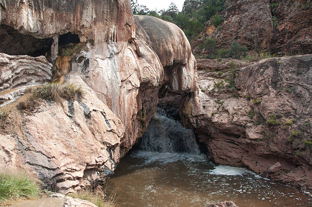 Hot springs deposited the minerals that created this natural dam on the Jemez River in northern New Mexico near Los Alamos. The natural dam is 300 feet long.