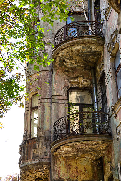istock Old house with birch on the balcony 490273200