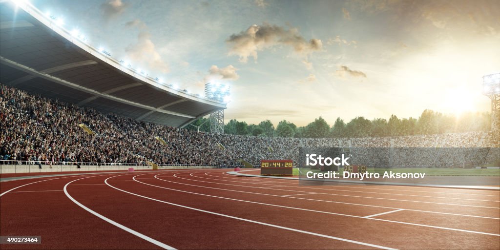 stadium with running tracks Sunny sport stadium with crowds of people at the background. On behind the stadium are green trees. The image was made in 3d. Running Track Stock Photo