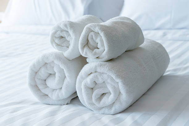 istock white bath towels in bed room, Room service 490273712