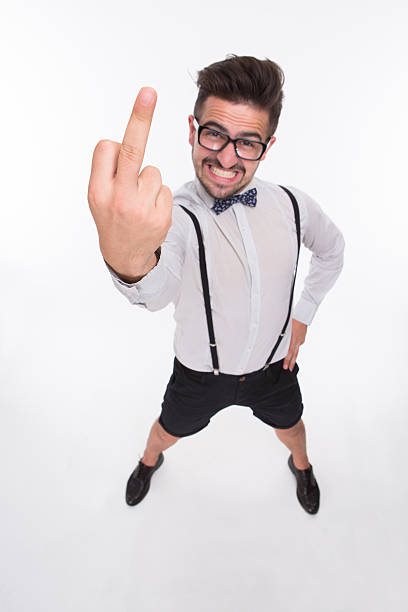 istock Smiling man showing middle finger 490273824