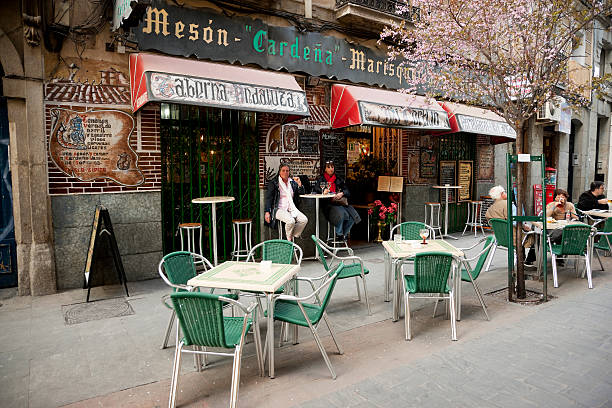 Madrid, Spain - March 16, 2012 : People having drinks and eating outdoors at the street restaurant TABERNA ANDALUZA \