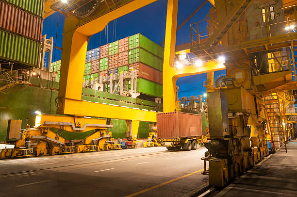 istock Cargo ship in the harbor at sunset . 490275834