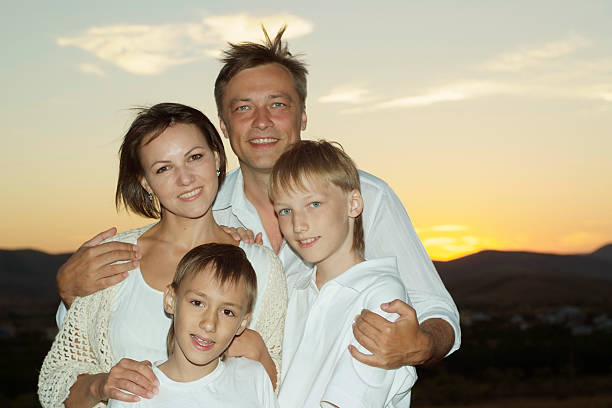 istock Friendly family against the sunset 490276062