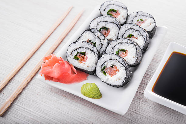 istock Closeup of sushi rolls 490277462