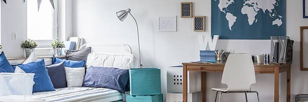 istock Bed and desk in white room 490277682