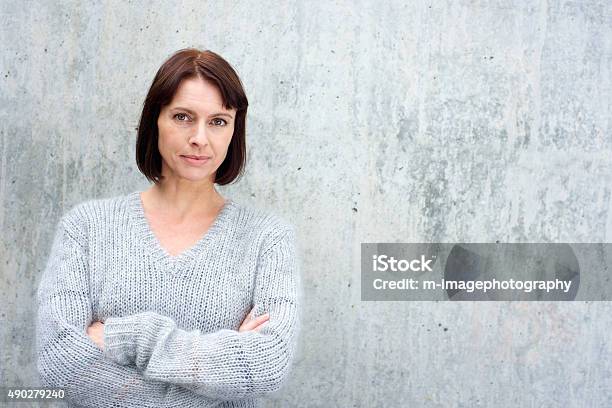 Attractive Older Woman In Wool Sweater Stock Photo - Download Image Now - Serious, Women, One Woman Only