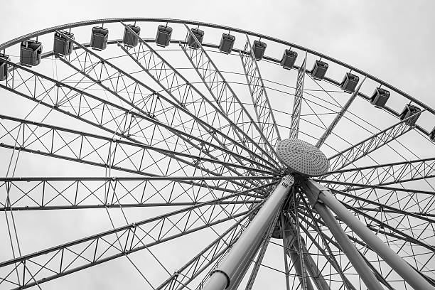 Low angle view of landmark Ferris wheel in Seattle, in black and white