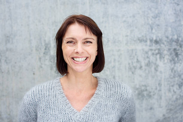 istock Close up smiling middle aged woman 490280652