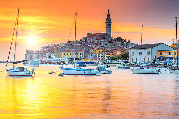 Beautiful sunset with Rovinj harbor,Istria region,Croatia,Europe Wonderful romantic old town of Rovinj and famous fishing harbor with magical sunset,Istrian Peninsula,Croatia,Europe istria photos stock pictures, royalty-free photos & images