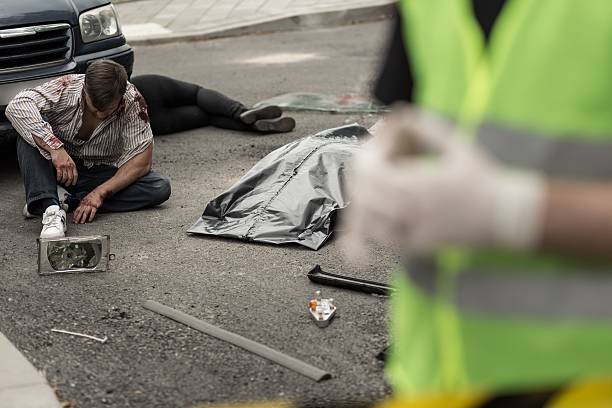 istock Injured man sitting on the street 490287742