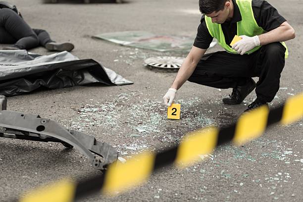Investigation at road accident area Policeman during investigation at road accident area barricade photos stock pictures, royalty-free photos & images