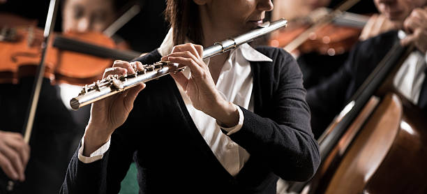 istock Symphony orchestra performance: flutist close-up 490302362