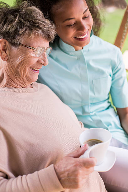 istock Elder lady and young nurse 490302966