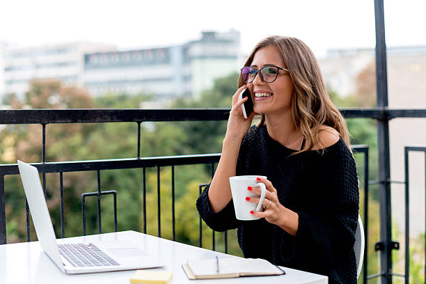 istock Smiling Young woman talking on mobile phone 490304782