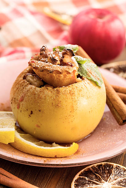 istock Baked apple with raisins, walnuts and cinnamon 490305144
